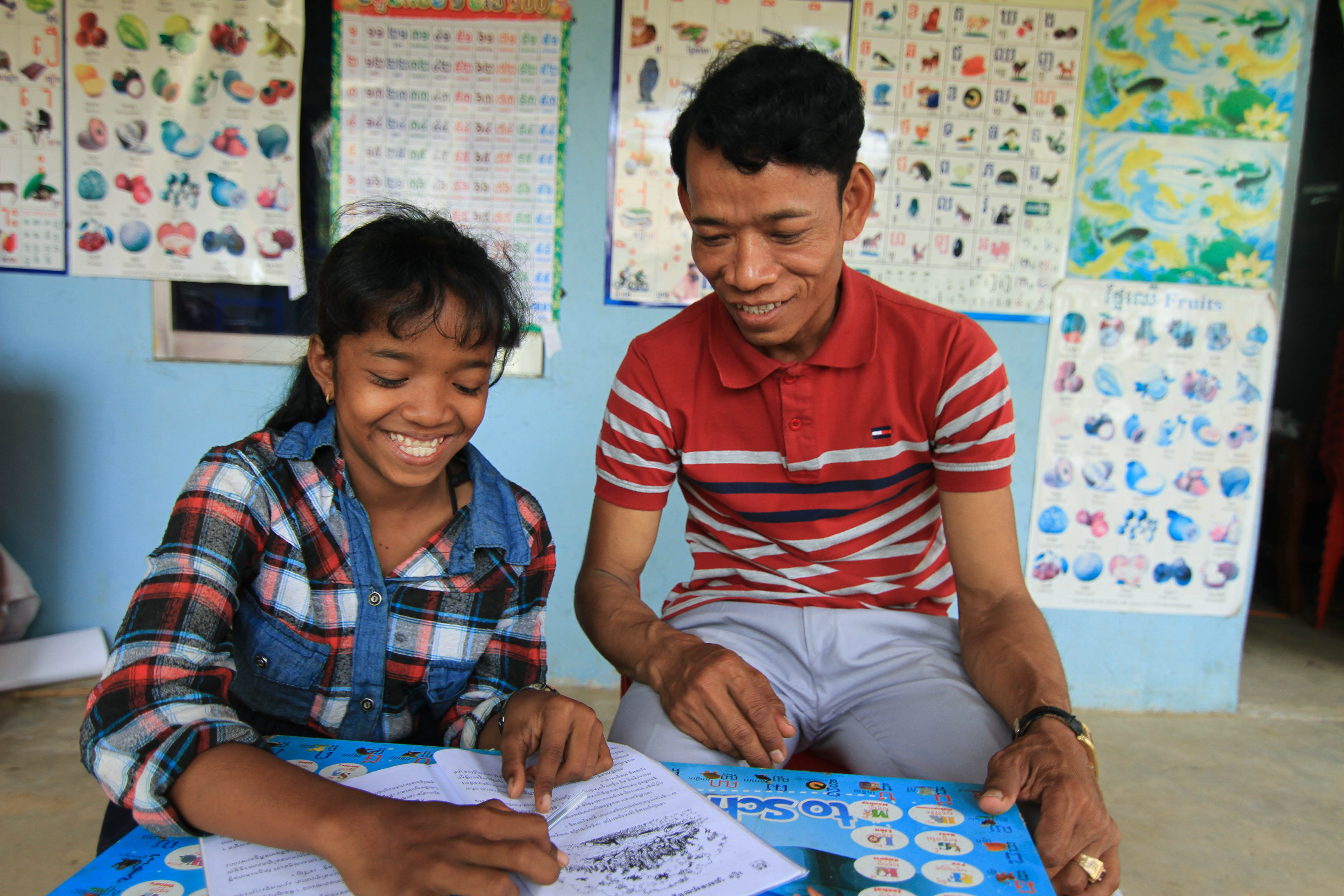 Smiling girl writing