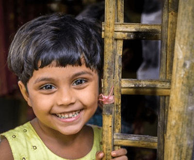 Girl smiles to the camera in Bangladesh