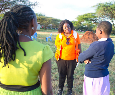 The National Director Lilian and the board members talking to Esther and the other girls