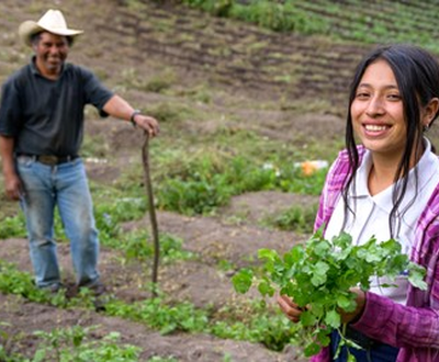 Nahomy helping her father in the field