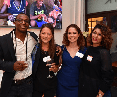 A man standing with three womes