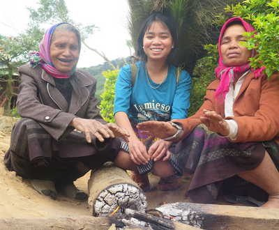 Three women from Vietnam warming their hands