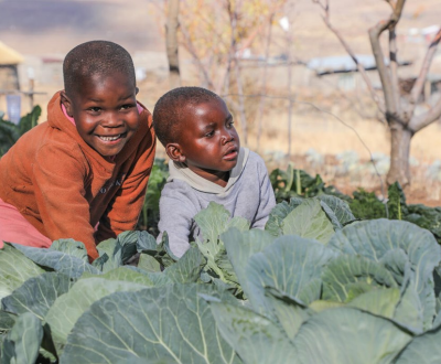 Two Kids inside fields