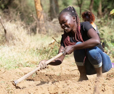 Ruth in the farm field in Kenya doing FMNR