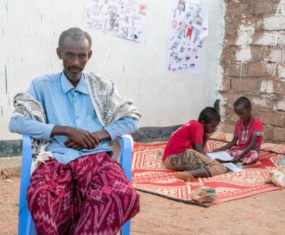 Said with his father and classmate practicing their reading