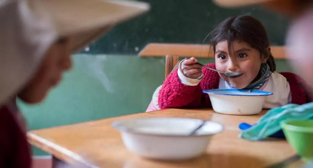 Child is having meals in school