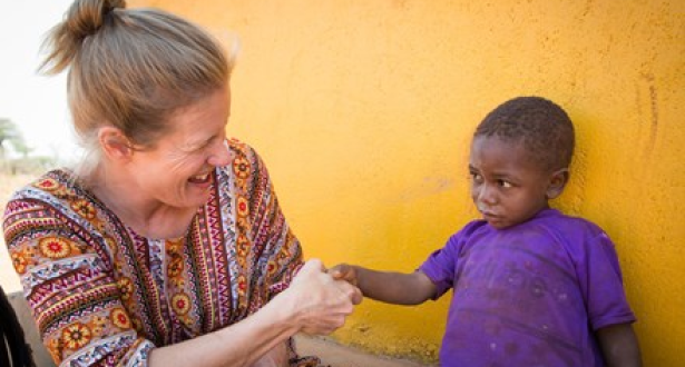 A World Vision ambassador pays visit to a sponsored child in Tanzania