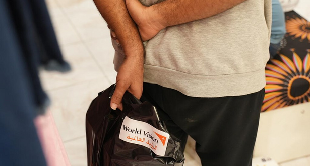 Someone Holding a worldvision bag.