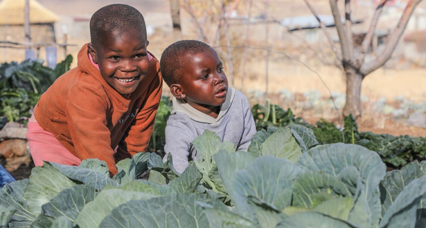 Two Kids inside fields