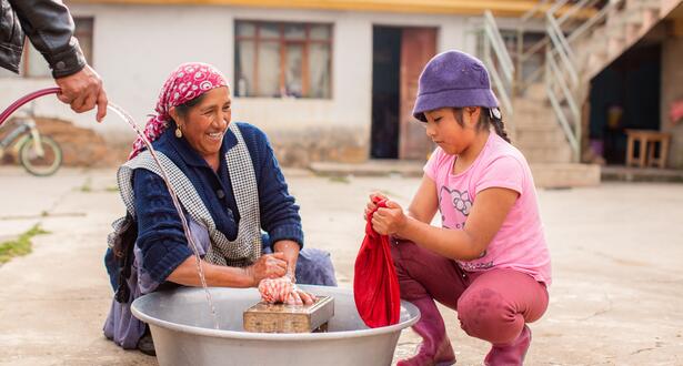 Woman smiling at child