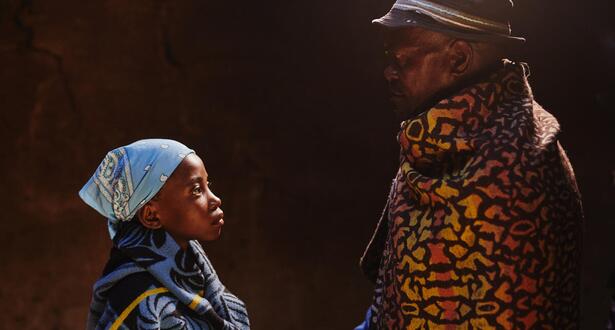 A father looking at his child- child marriage context.