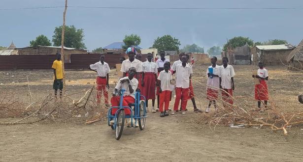 Child on his tricycle