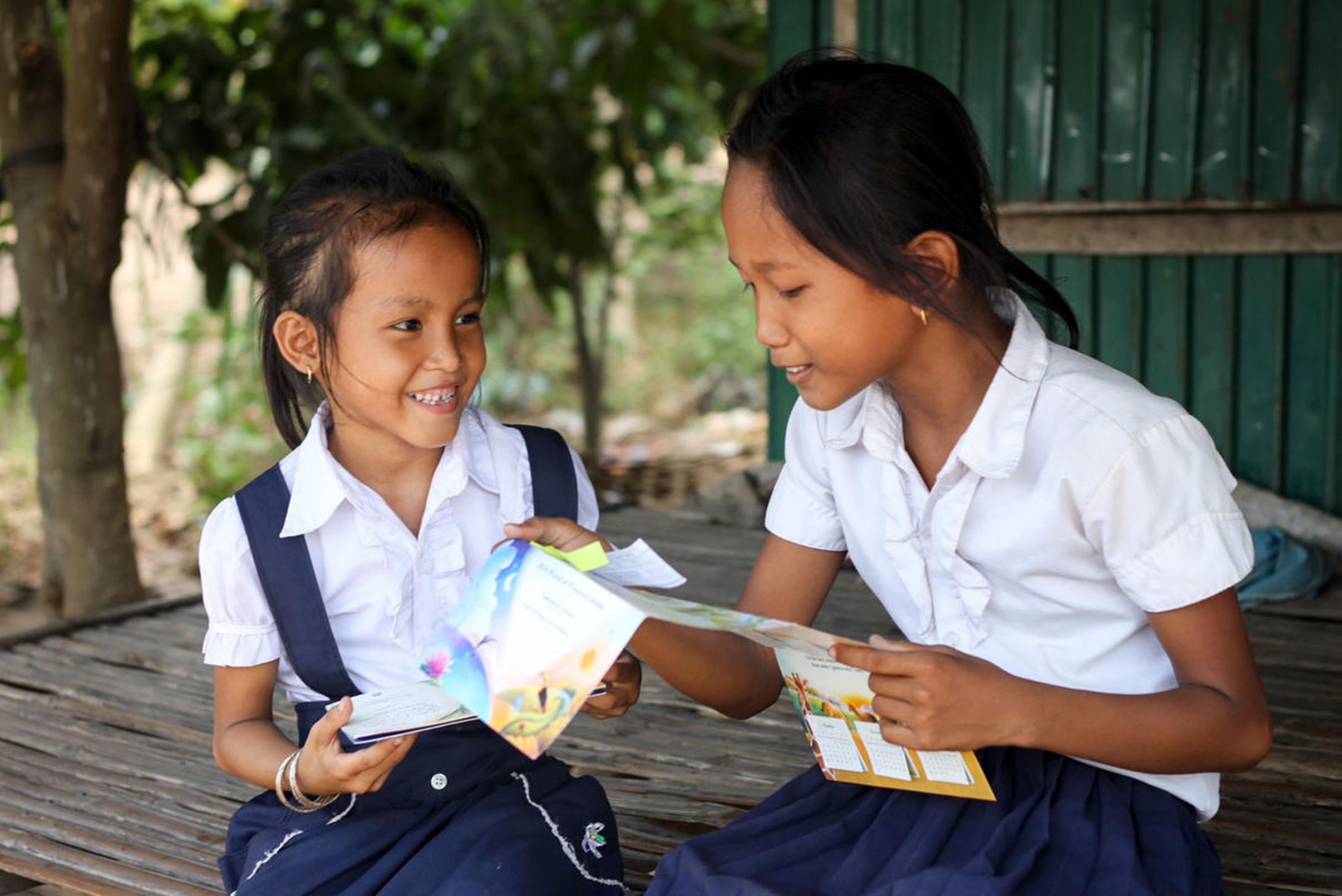 World Vision's sponsored child, Saro from Cambodia, is excited to read the letter from her sponsor