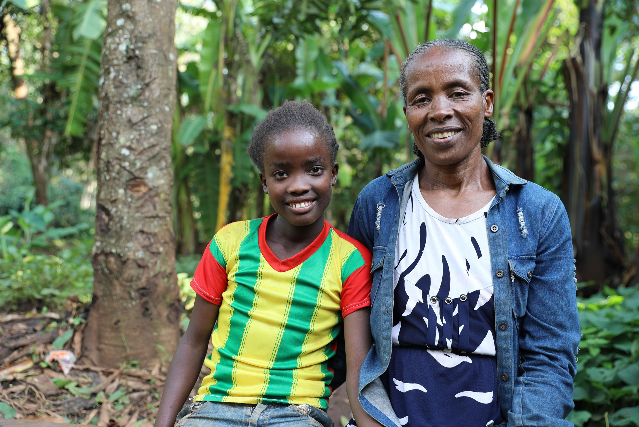 Girl form Ethiopia next to her mother.