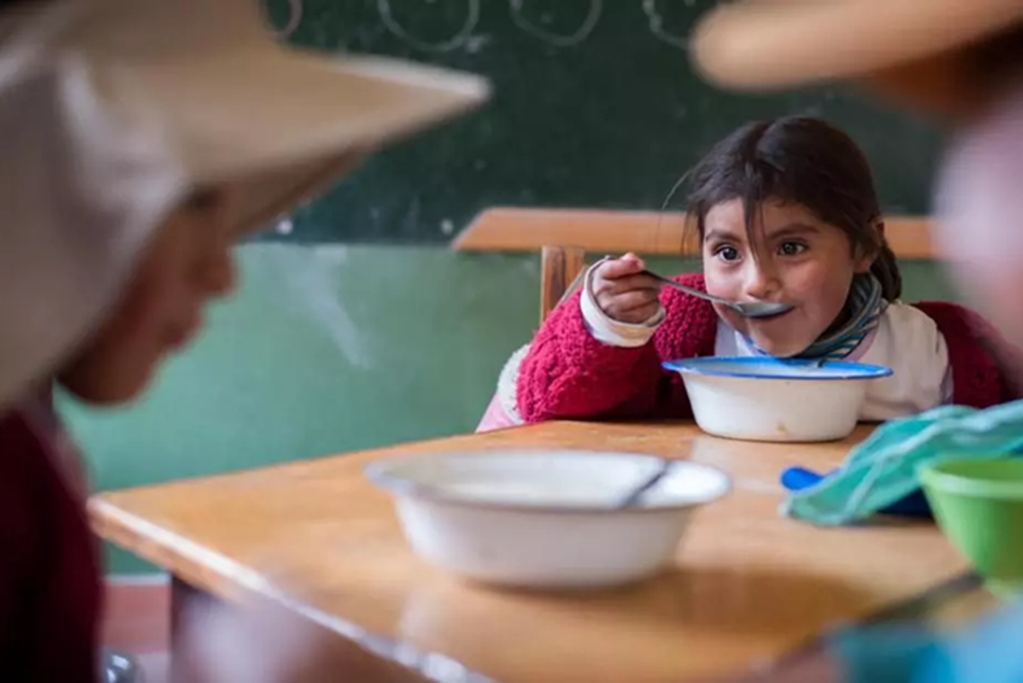 Child is having meals in school