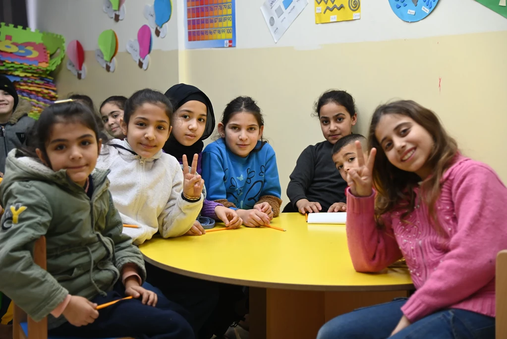 The Kids of Tripoli siting inside a classroom