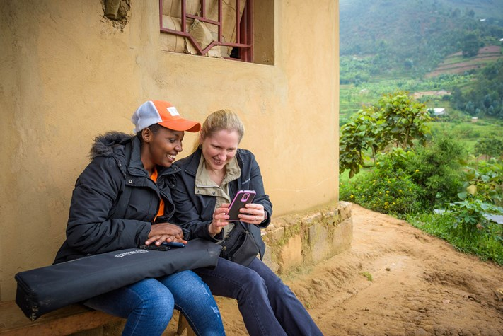 Two women looking into their phones