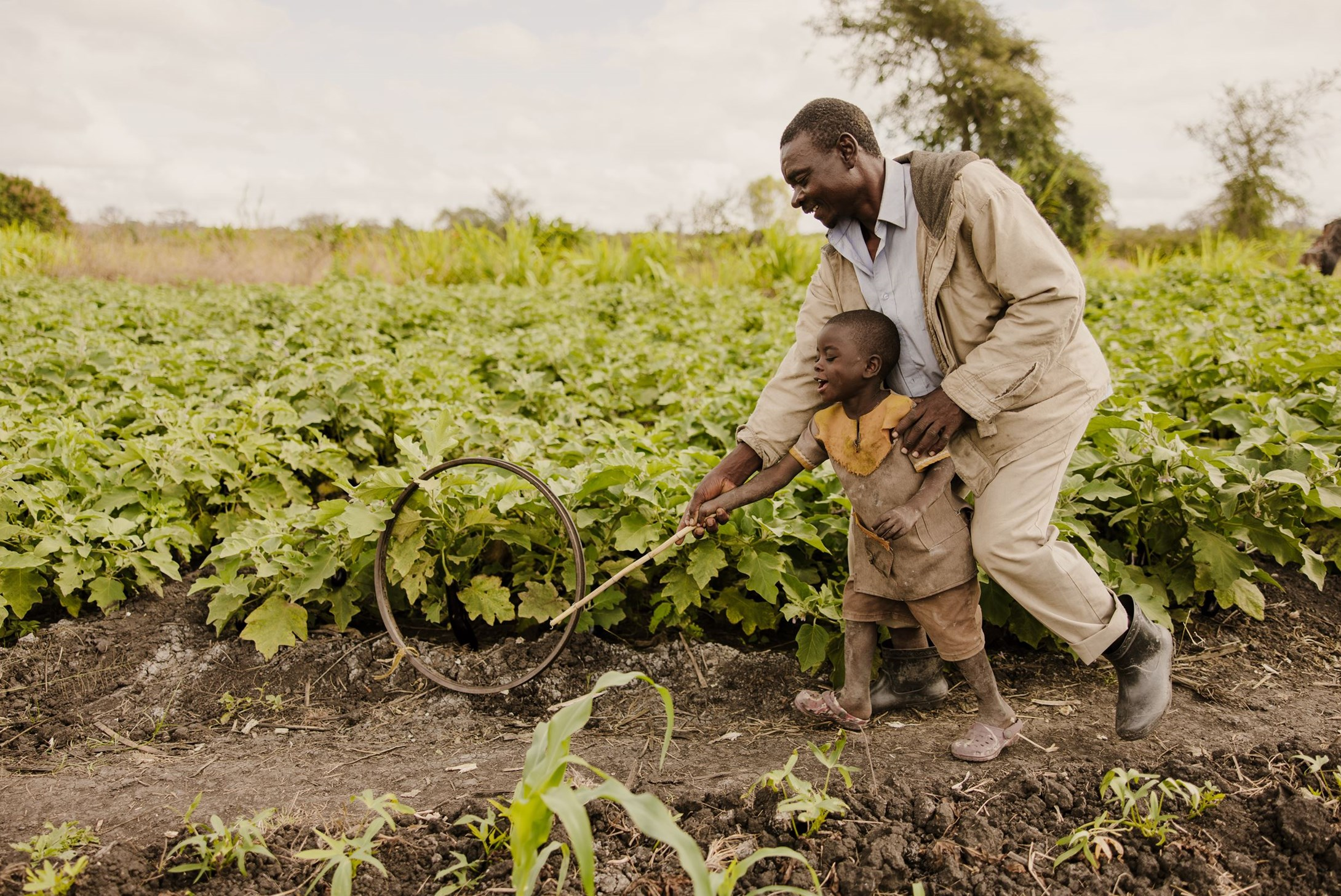 A father in Matope, Malawi, plays with his young son. 