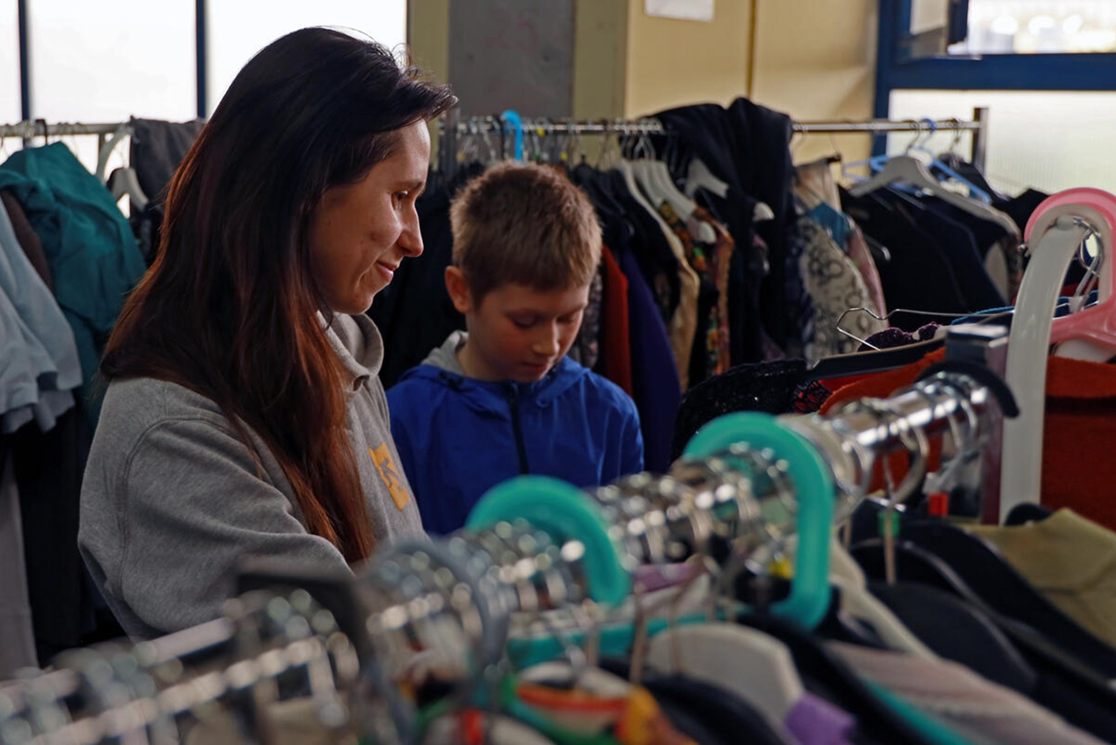 Victoria and her son, Arsenij, left home in Udesa, Ukraine, currently living in Bucharest, collect food, clothes and toys.