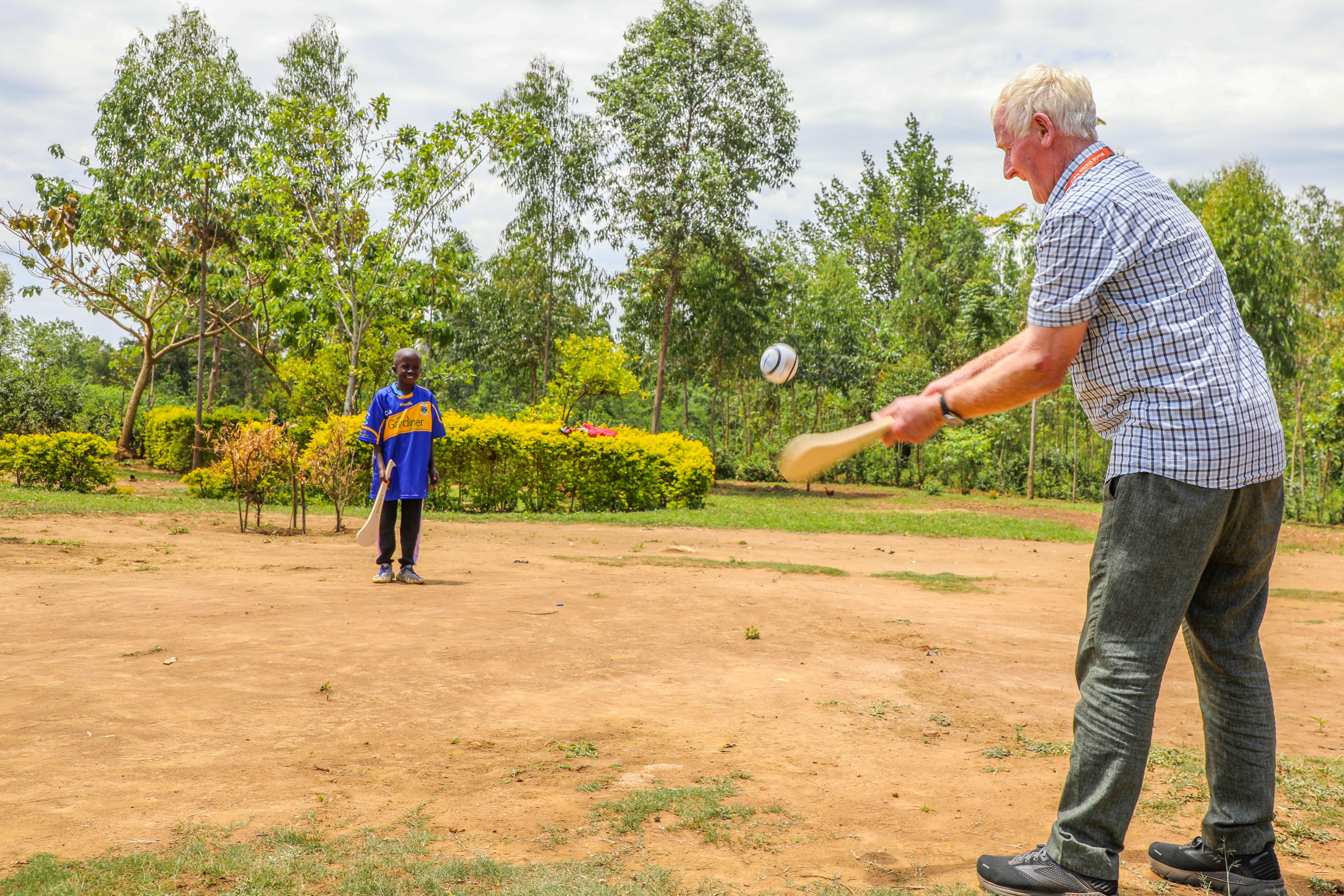 John and Yazidi playing hurling