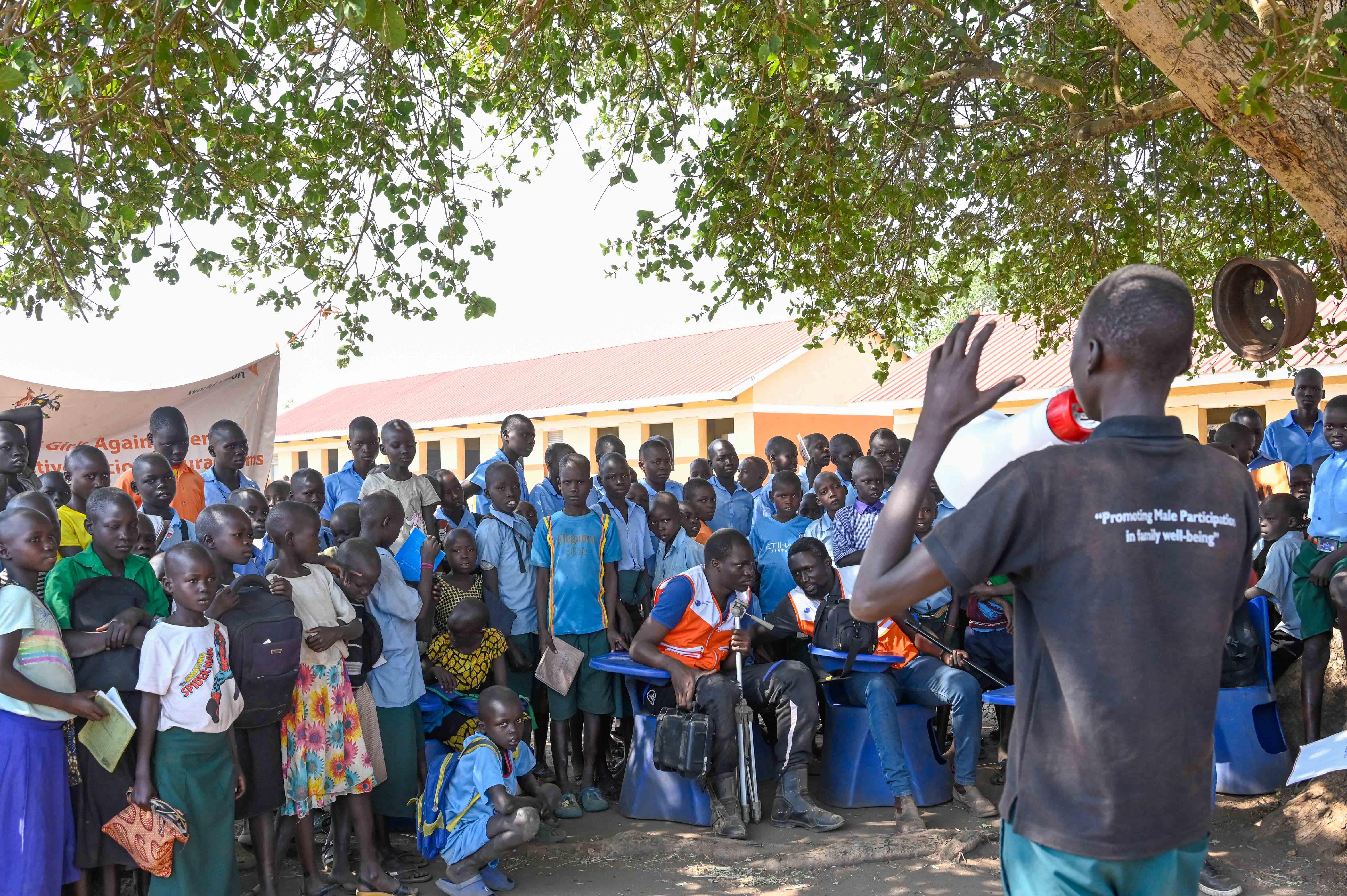 Male action group members during a community sensitization drive in Maaji refugee settlement.