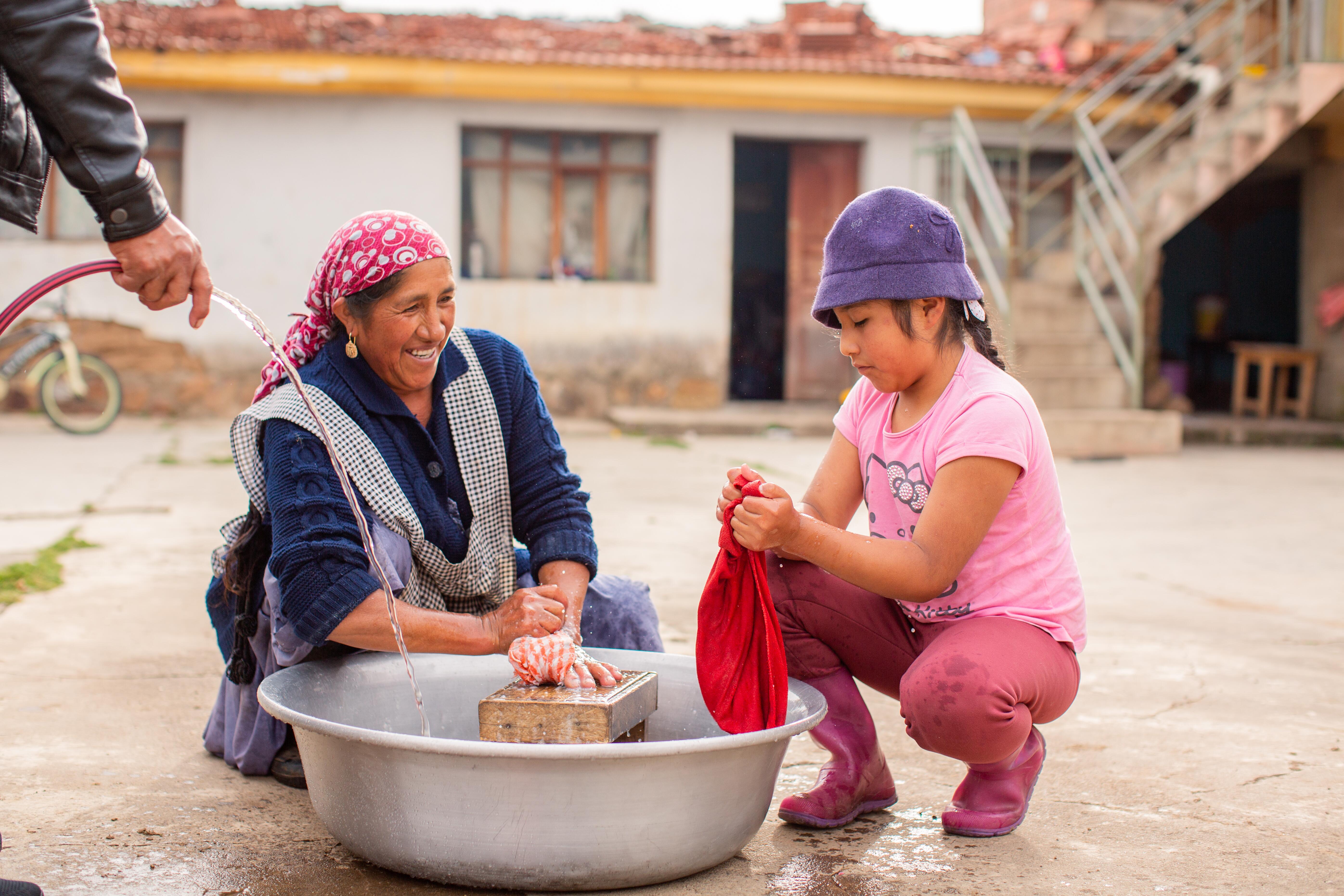 Woman smiling at child