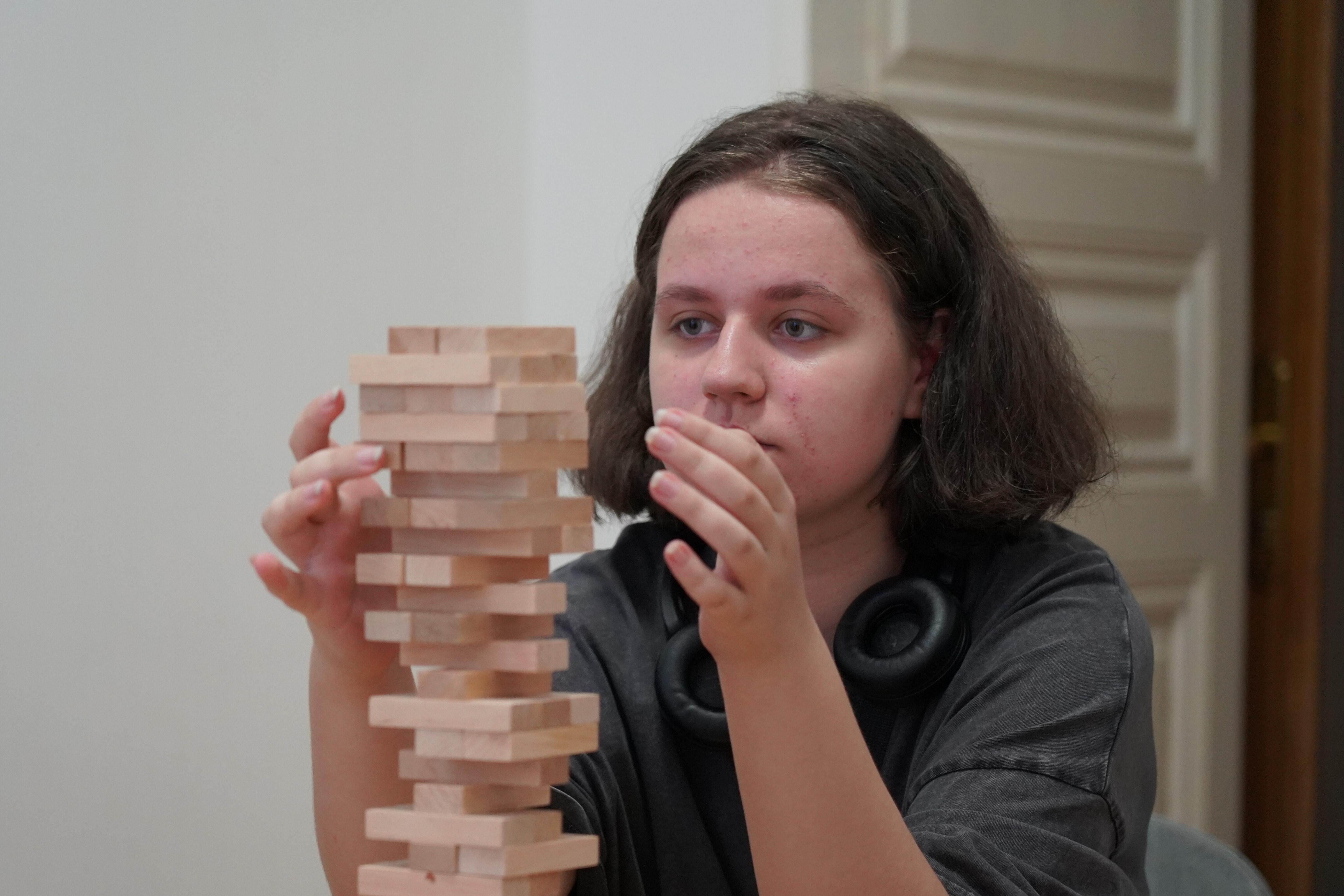 Eva playing Jenga