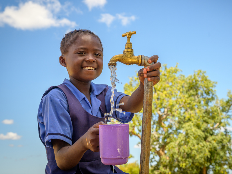Girl holding cup of water