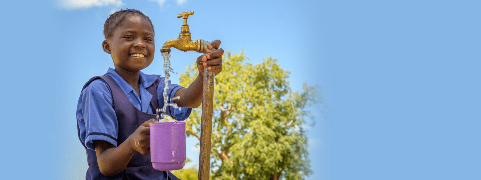 Girl holding cup of water